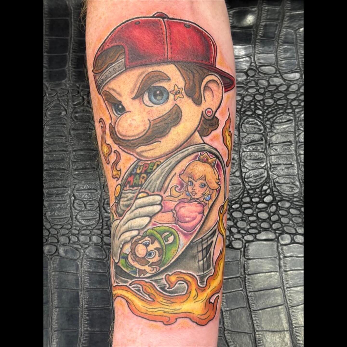 Mario new school tattoo on the forearm by Joshua Shawn