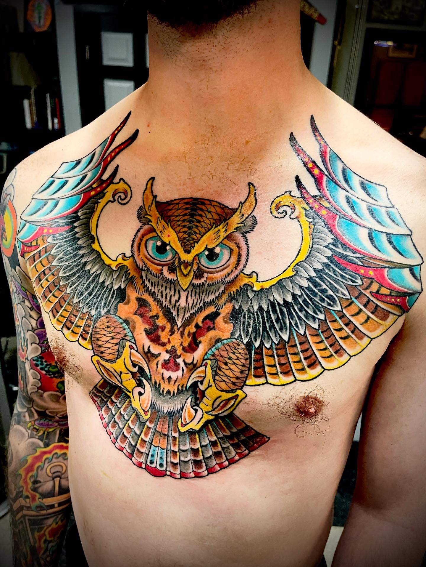 Owl American traditional tattoo on the chest by Jacob Finelli