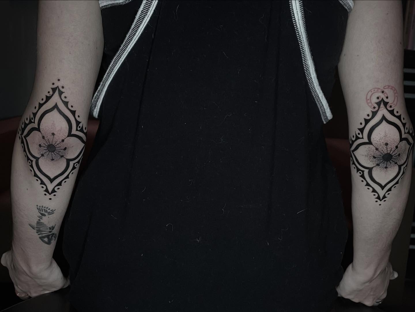 Flower geometric tattoo on the forearm by Xena