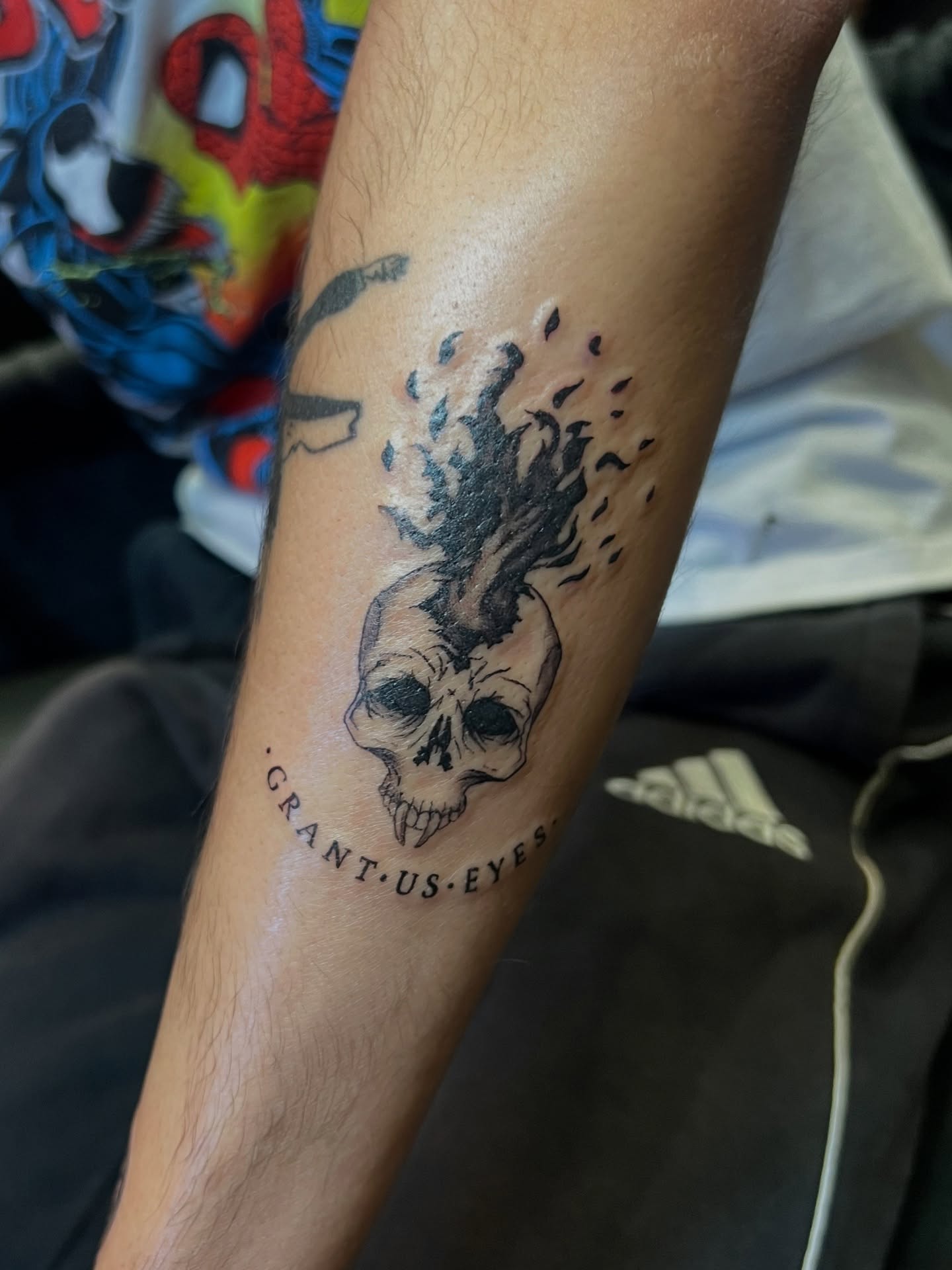 Flaming skull black and grey tattoo on the forearm by tatman cris 🥀 dfw tattoo artist