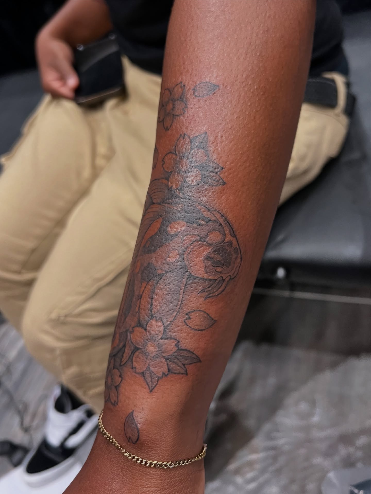 Floral design black and grey tattoo on the forearm by tatman cris 🥀 dfw tattoo artist