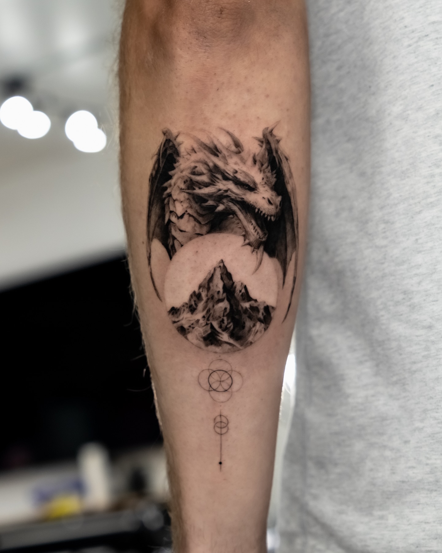 Dragon realism tattoo on the forearm by Riley K Turner
