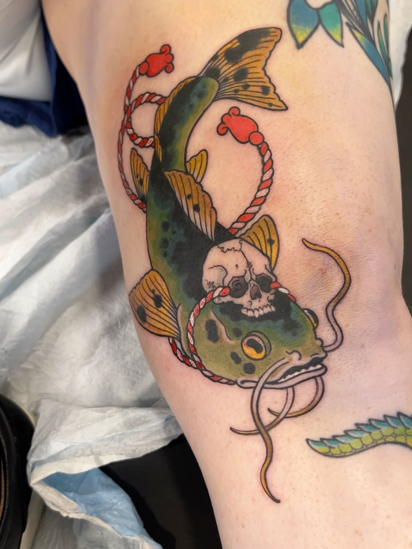 Fish with skull American traditional tattoo on the thigh by English Cousins, Nashville, Tennessee