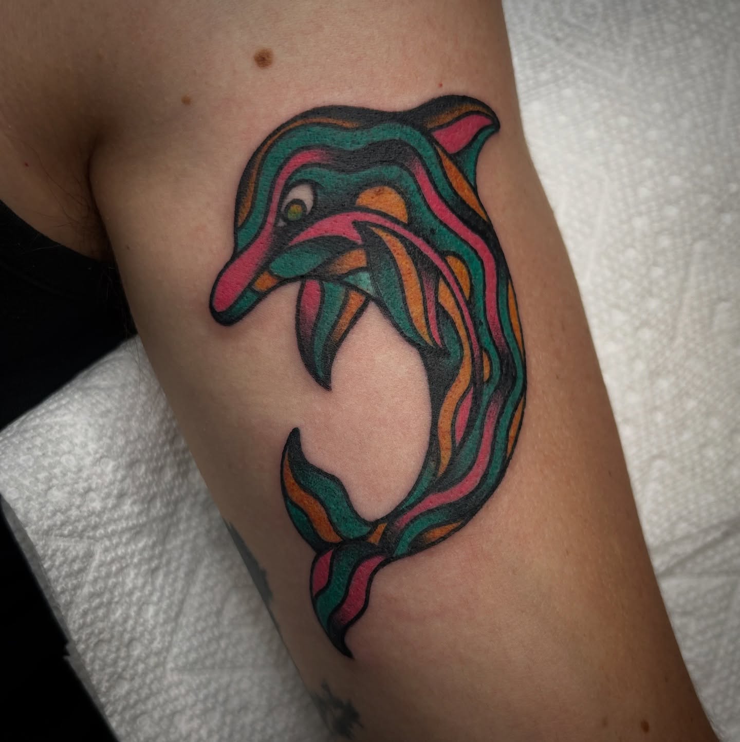 Dolphin new school tattoo on the forearm by Bright-bold-classic Tattoos, North Hills