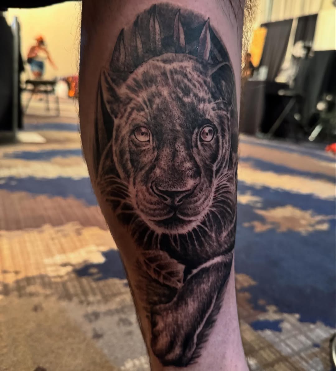 Lioness portrait realism tattoo on the forearm by Tattoos by Fesik LLC