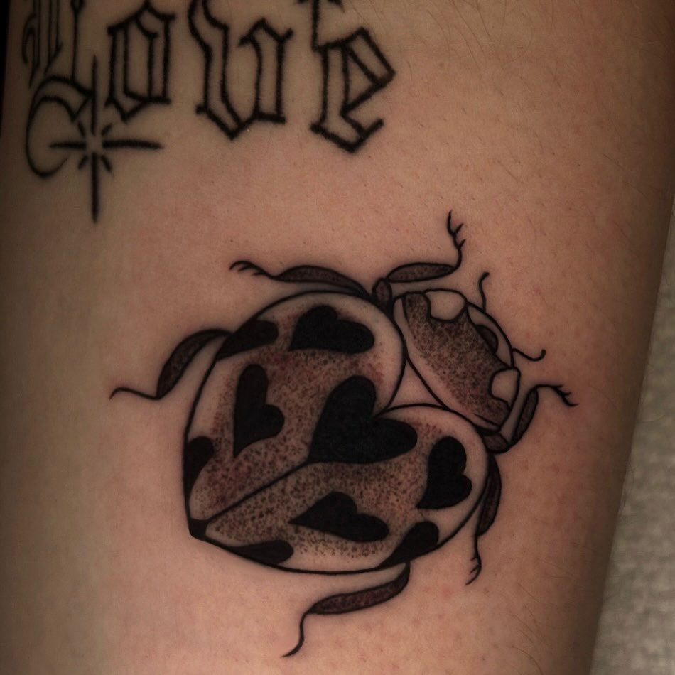 Ladybug dotwork tattoo on the forearm by Ashley Lambert