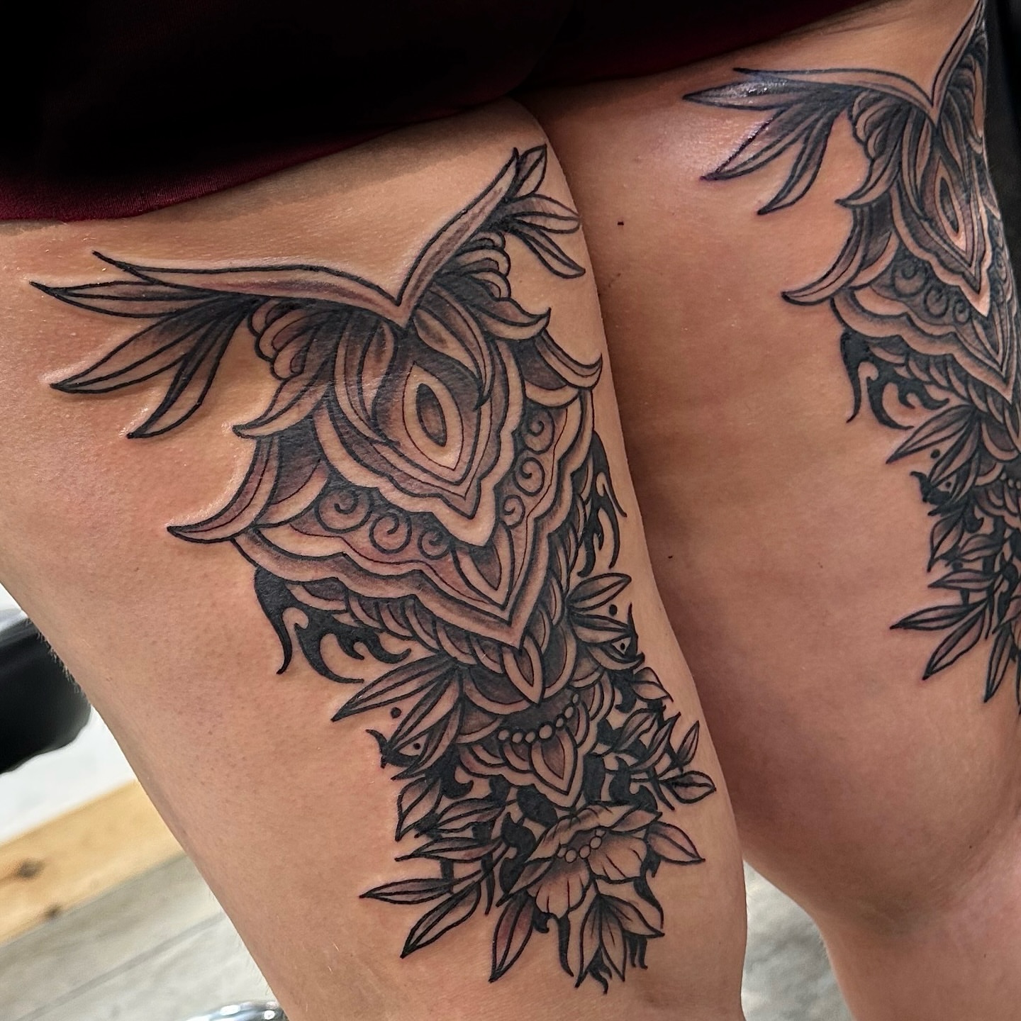 Owl and floral ornamental tattoo on the thigh by Emily K Lingg