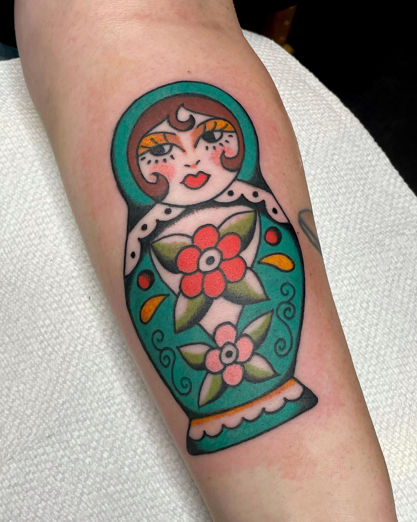 Matryoshka doll American traditional tattoo on the forearm by nancy❣️