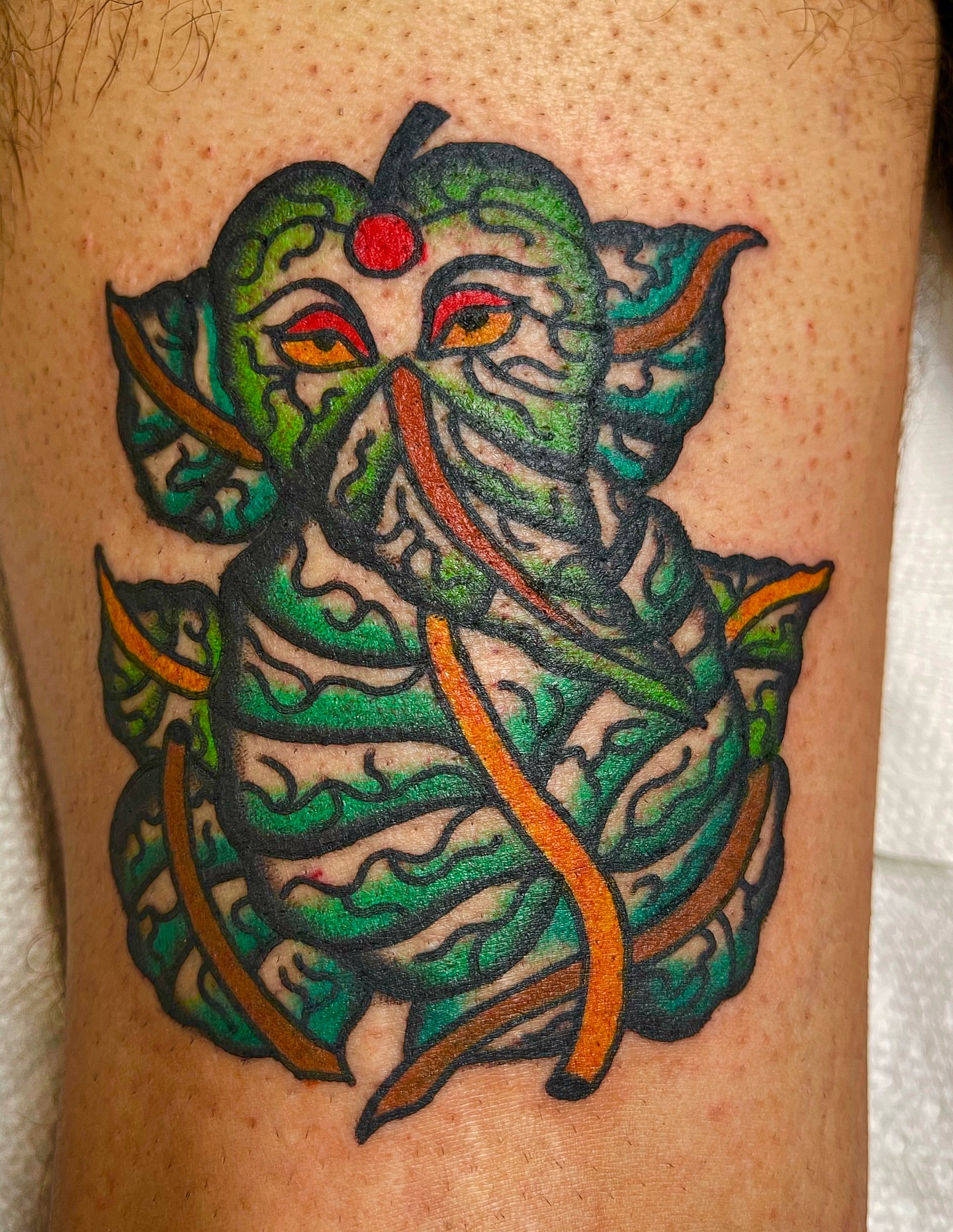 Ganesha American traditional tattoo on the thigh by Swasthik Iyengar, New York, New York
