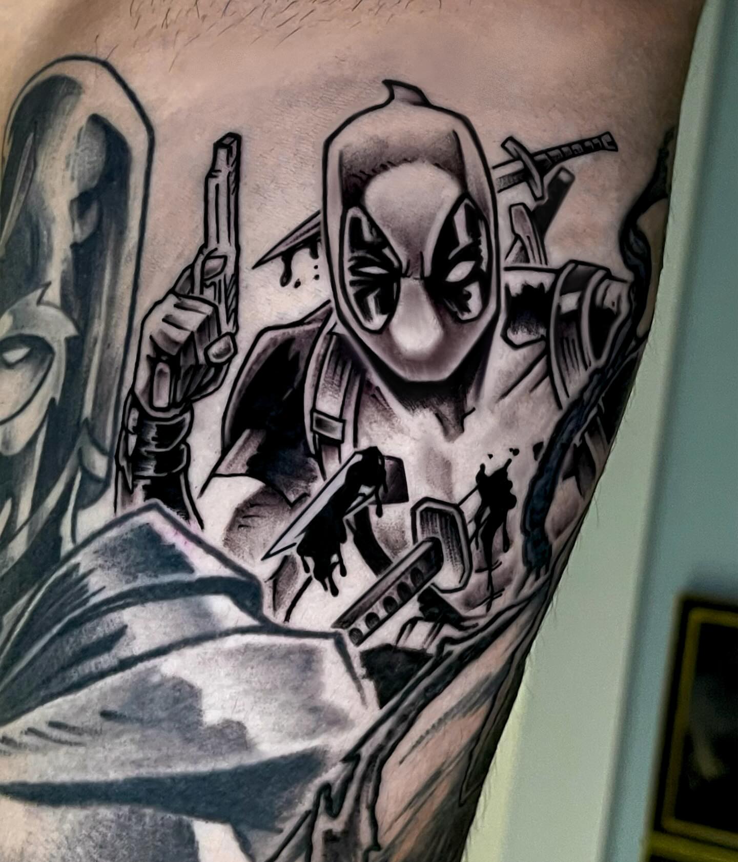 Deadpool black and grey tattoo on the forearm by Nicholas Capellan, Winter Park, Florida