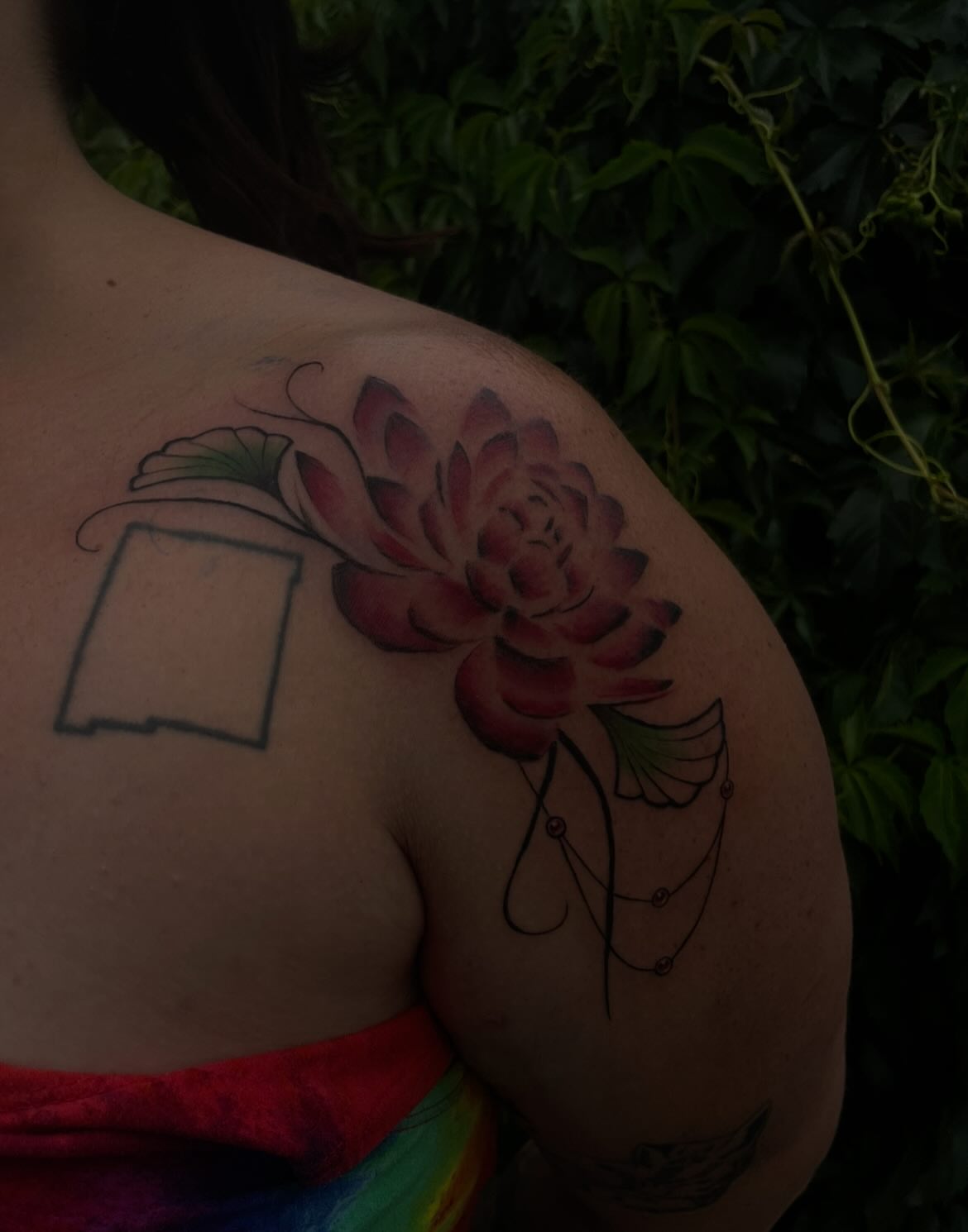 Lotus flower realism tattoo on the shoulder by Trinity