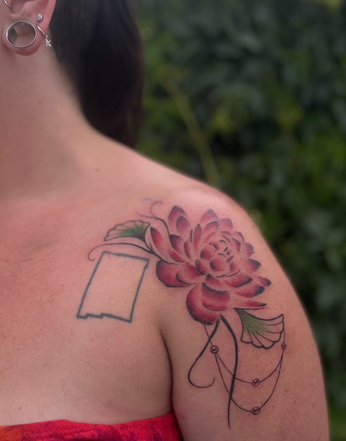 Flower and outline new school tattoo on the shoulder by Trinity