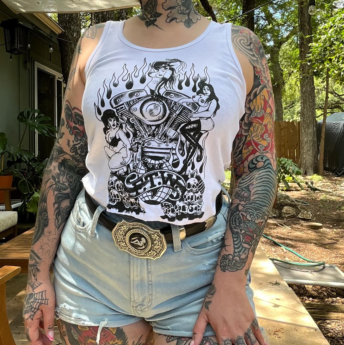 Motorcycle and pin-up girls American traditional tattoo on the torso by Hannah Edwards, Austin, Texas