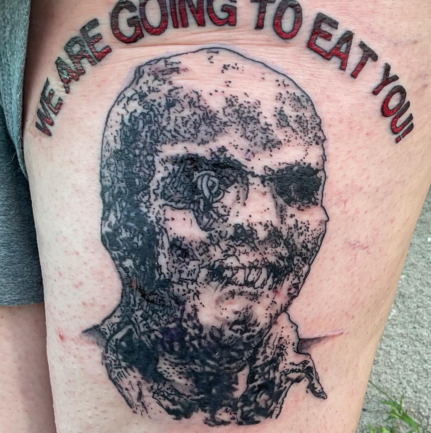 Zombie head dotwork tattoo on the thigh by Roachrude