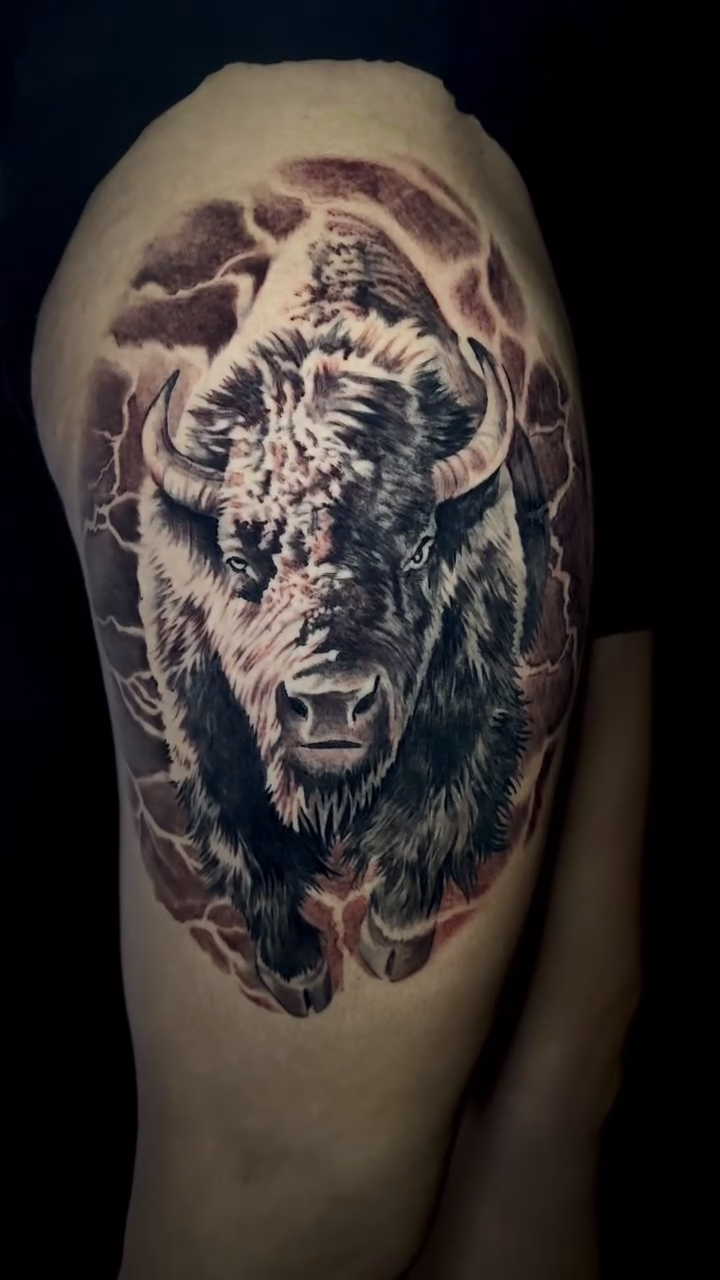 Bison head tattoo realism tattoo on the shoulder by Jarrod Gatzke