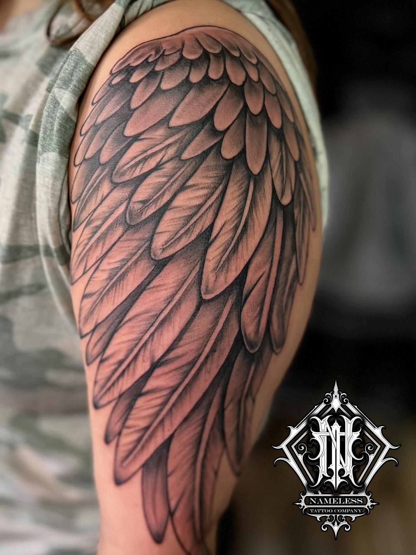 Wing realism tattoo on the shoulder by AJ