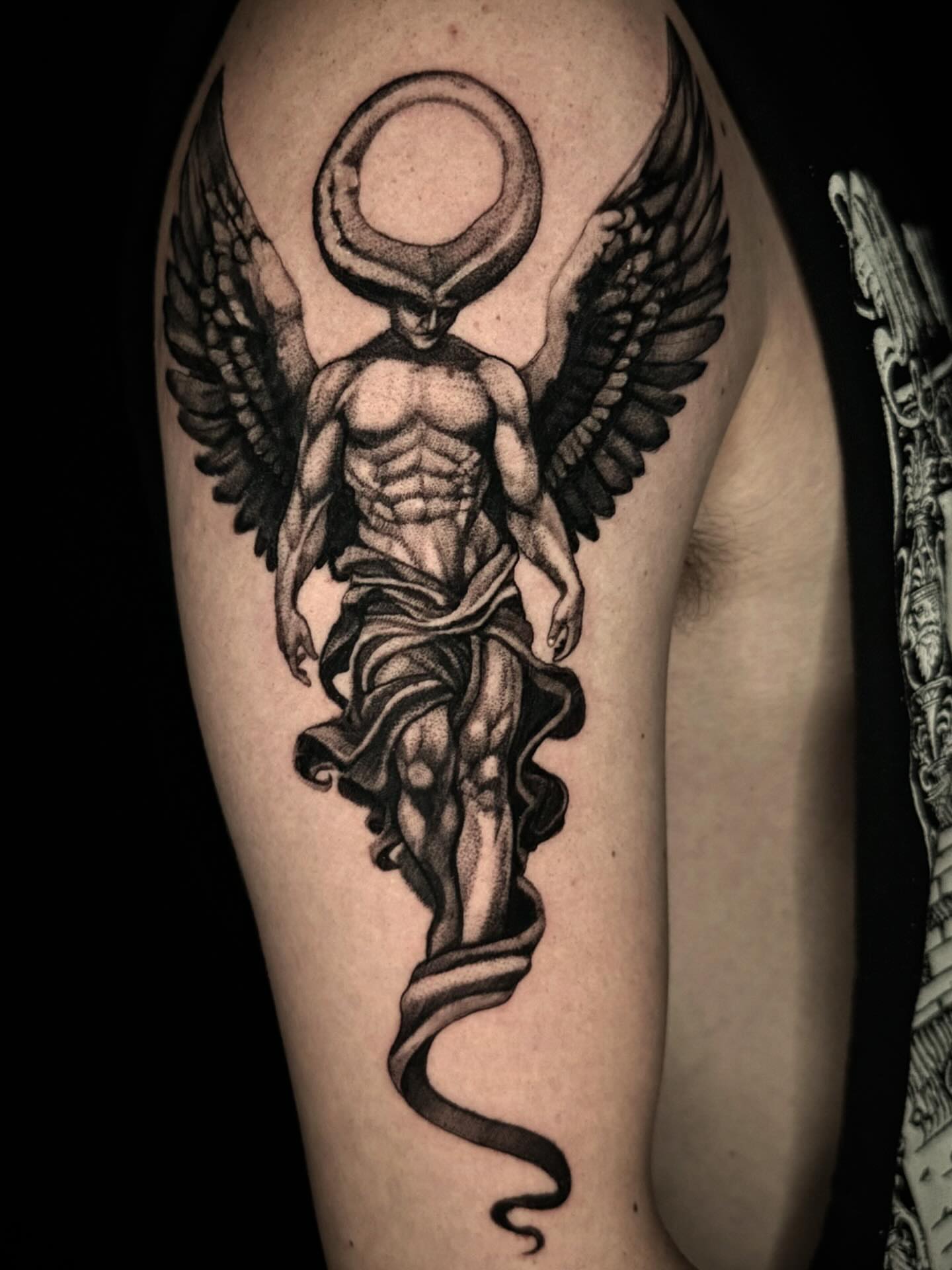 Winged angel realism tattoo on the upper arm by Mandi Marie, Charlotte, North Carolina