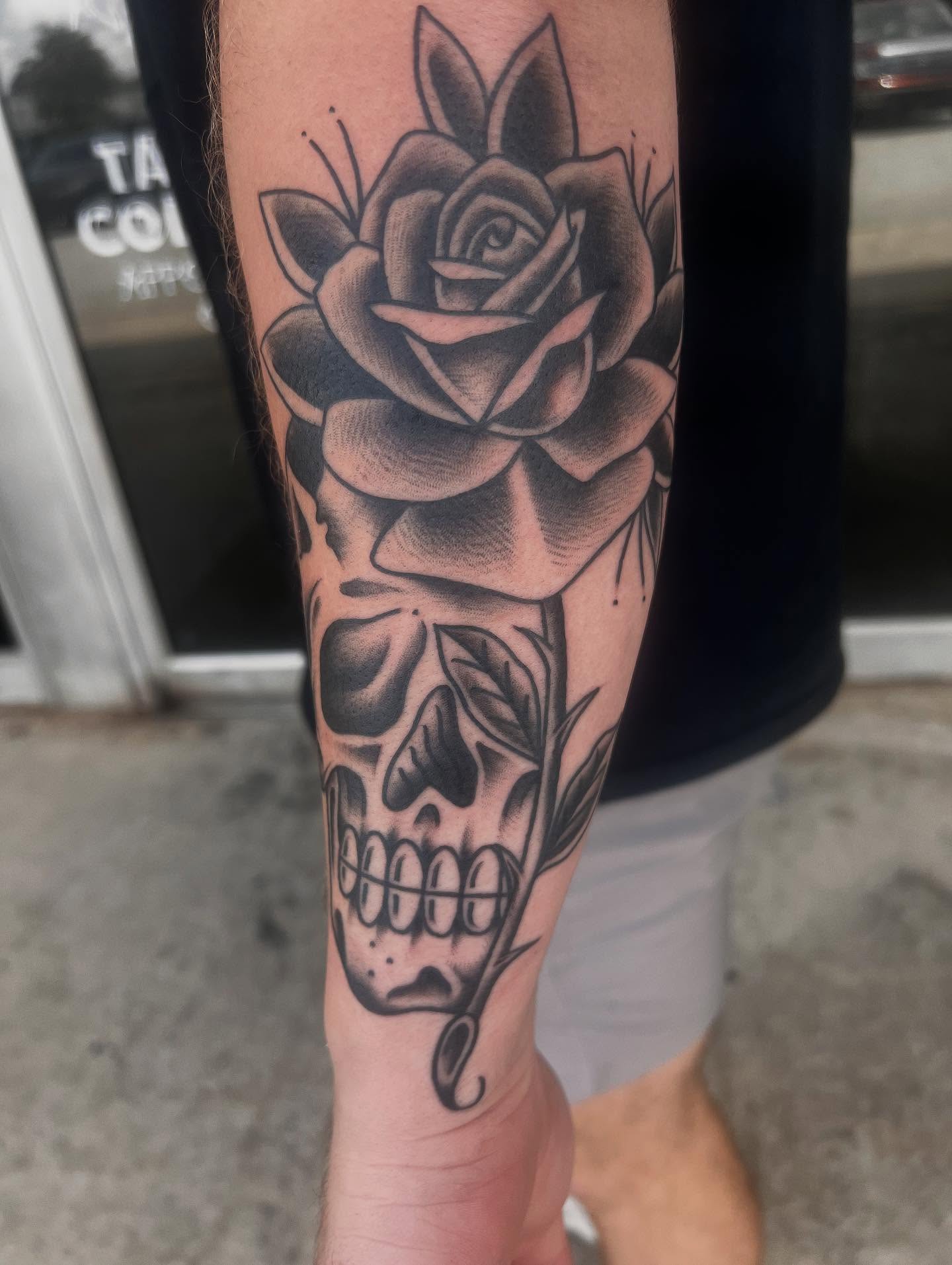 Rose and skull realism tattoo on the forearm by Ashley matthews
