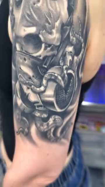 Skull with gas mask and snake dark realism tattoo by Steve Bishov