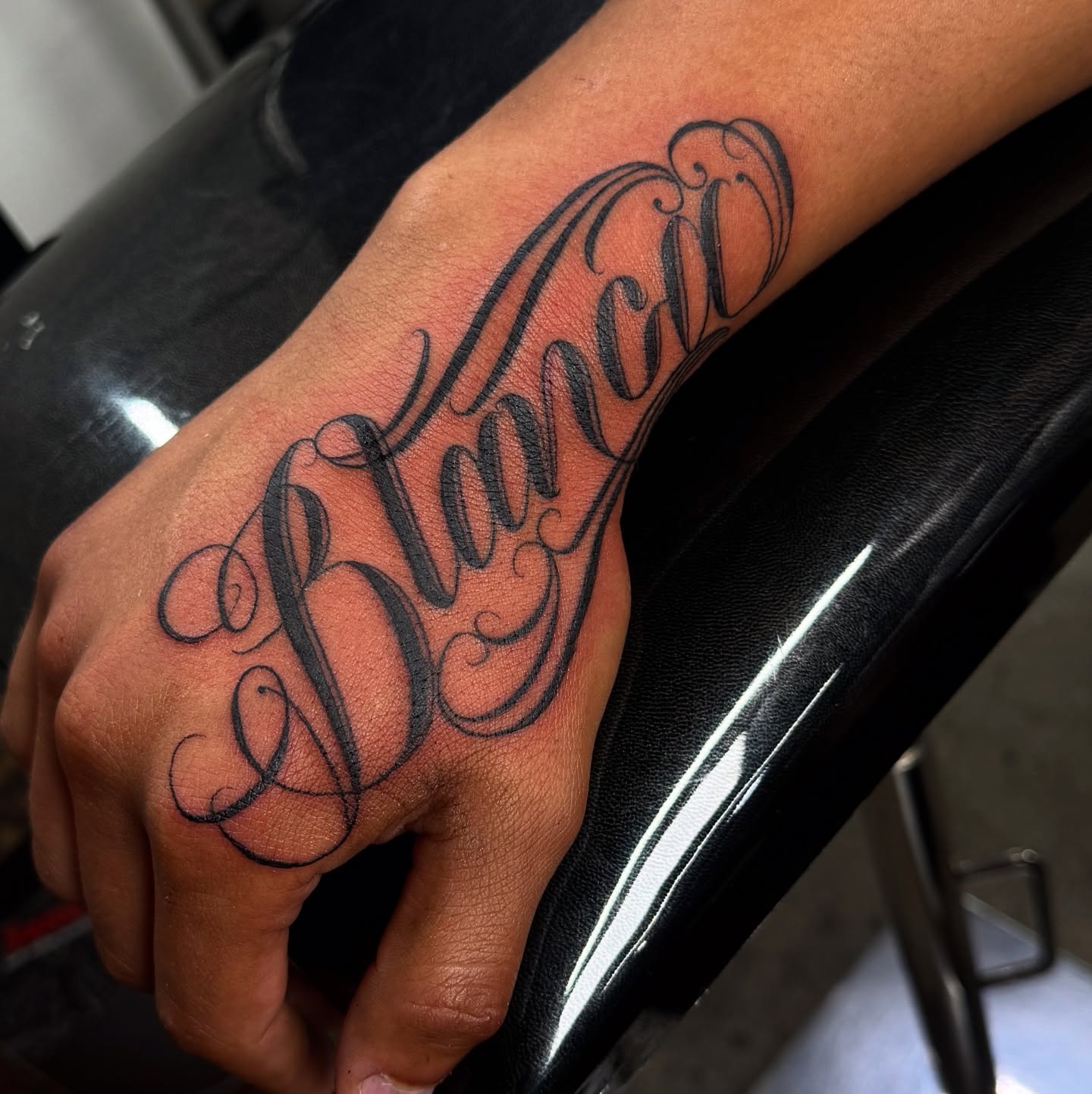 Script lettering lettering script tattoo on the hand by Anthony Duran