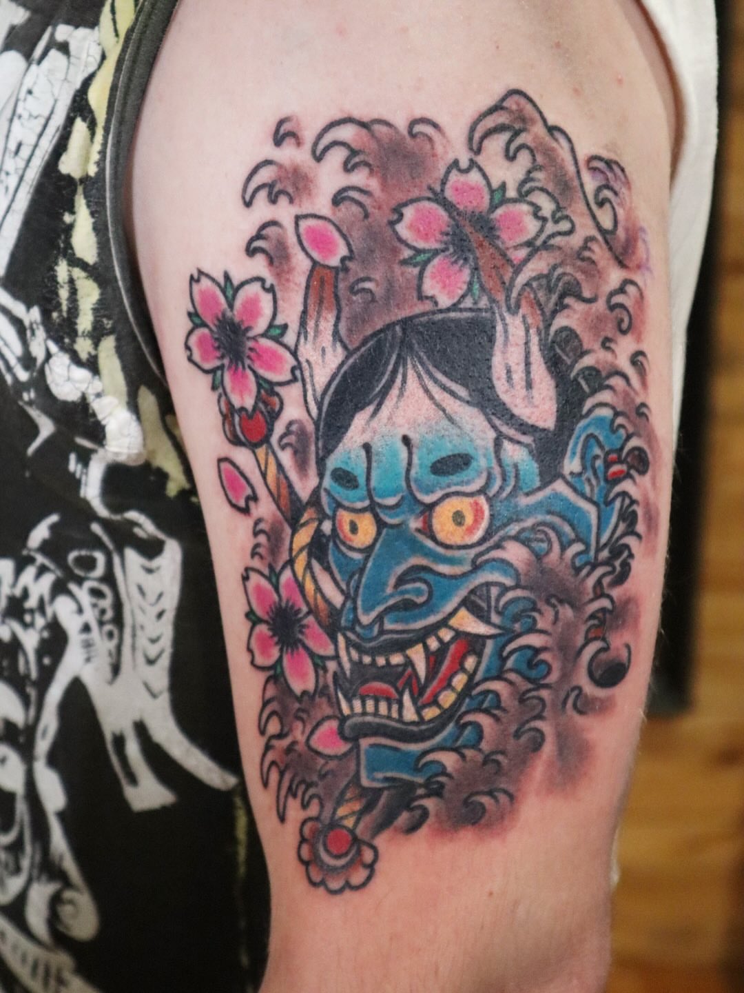 Mask with flowers japanese irezumi tattoo on the thigh by Eric James, Columbus, Ohio