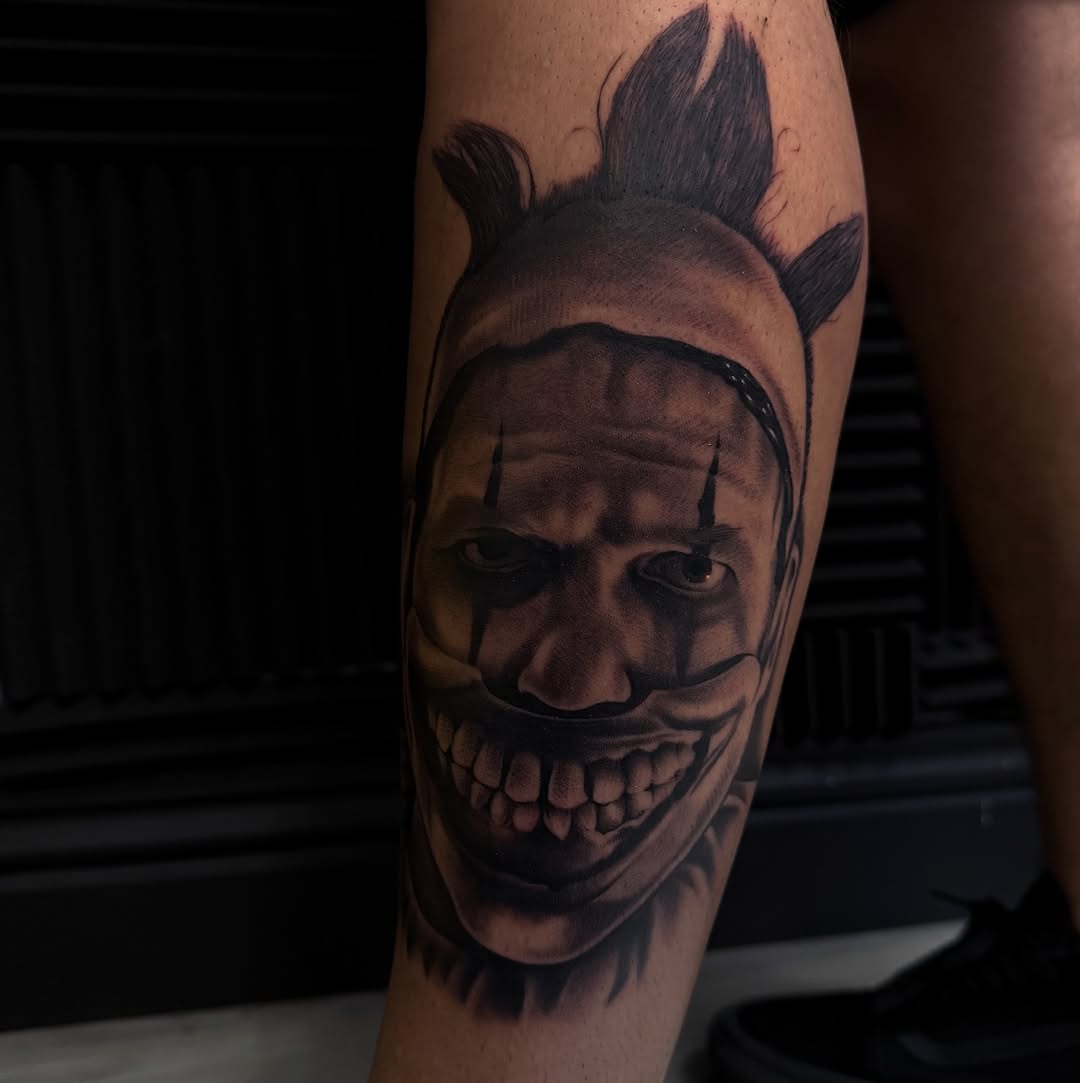 Twisty the Clown portrait realism tattoo on the forearm by Nick Campbell