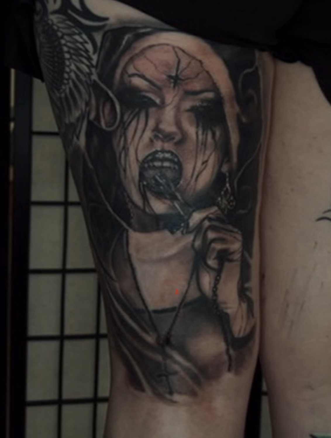 Woman with chains realism tattoo on the thigh by C.J. Rued