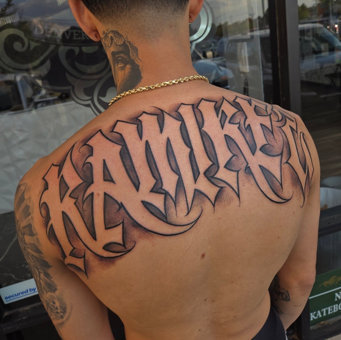 Script lettering lettering script tattoo on the back by DiazTattoos, Denver, Colorado