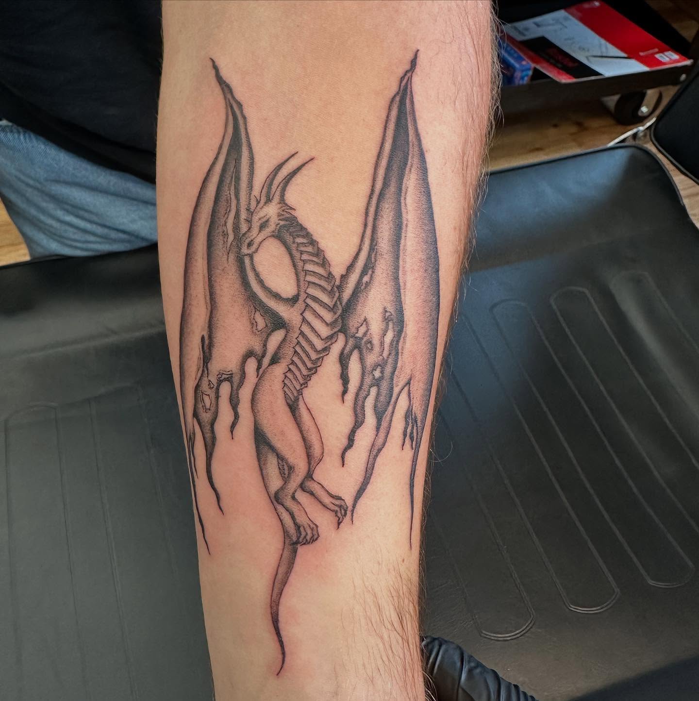 Dragon black and grey tattoo on the forearm by Marie Novotny, Lakewood, Ohio