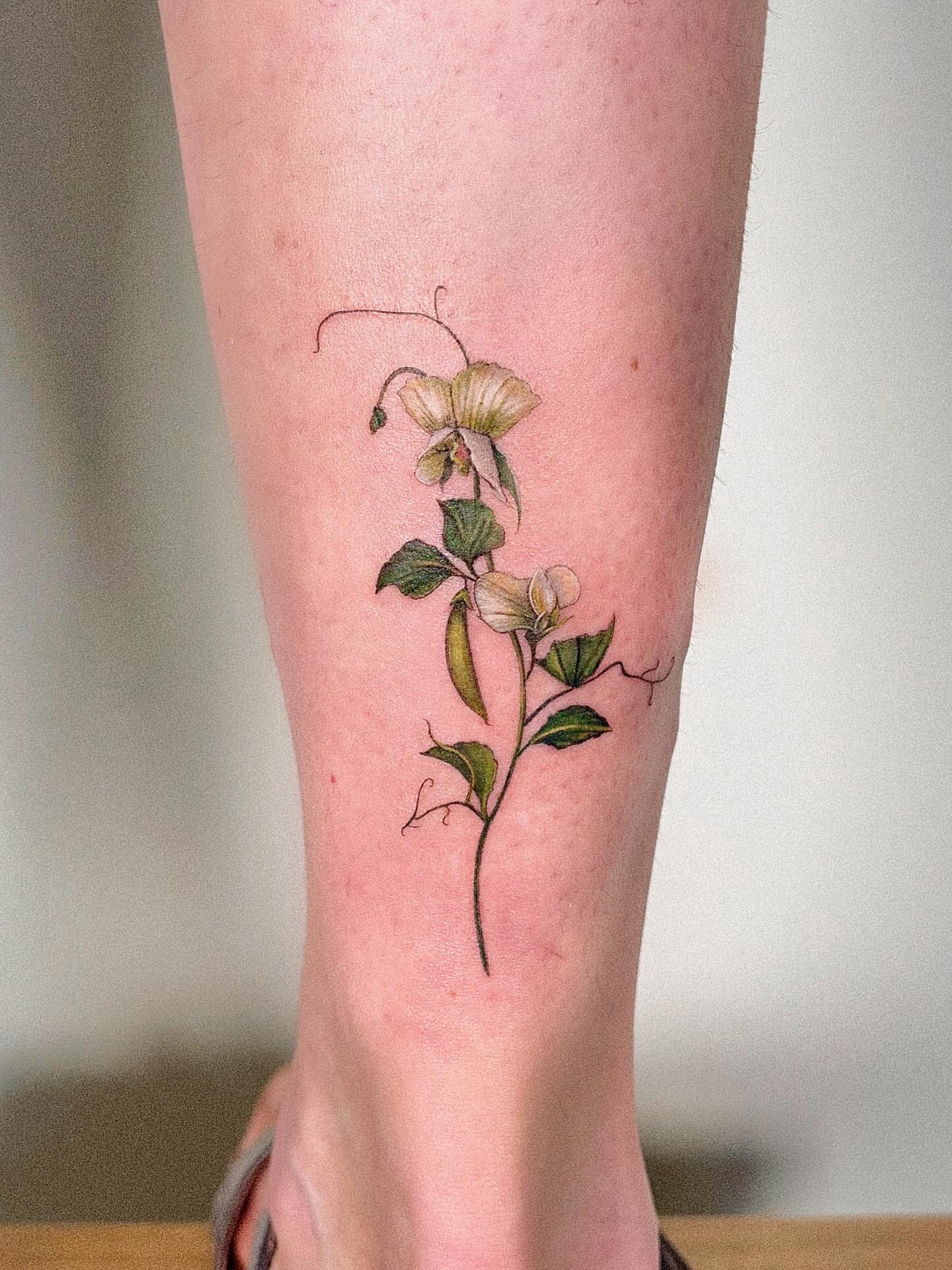 Peony flowers realism tattoo on the calf by Alissa Jung