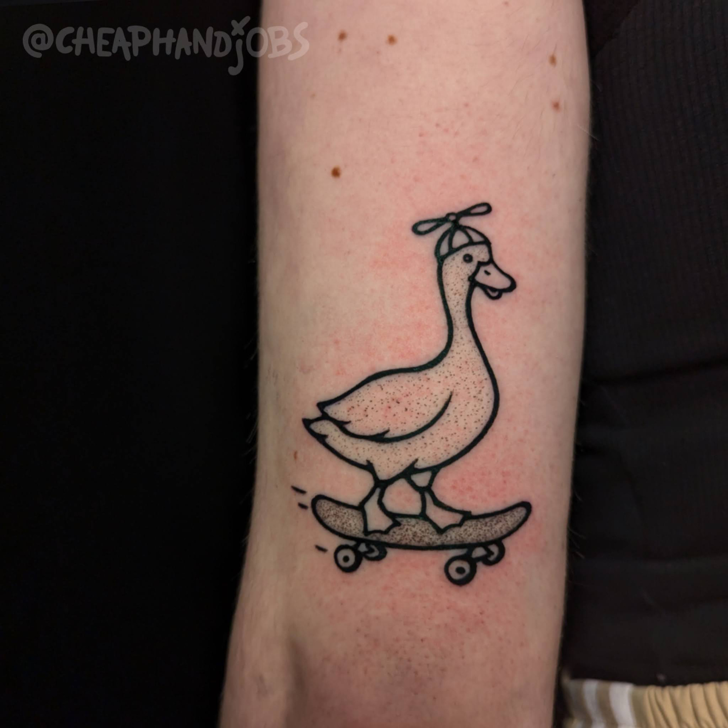Goose on skateboard dotwork tattoo on the forearm by @cheaphandjobs, Leipzig, Germany