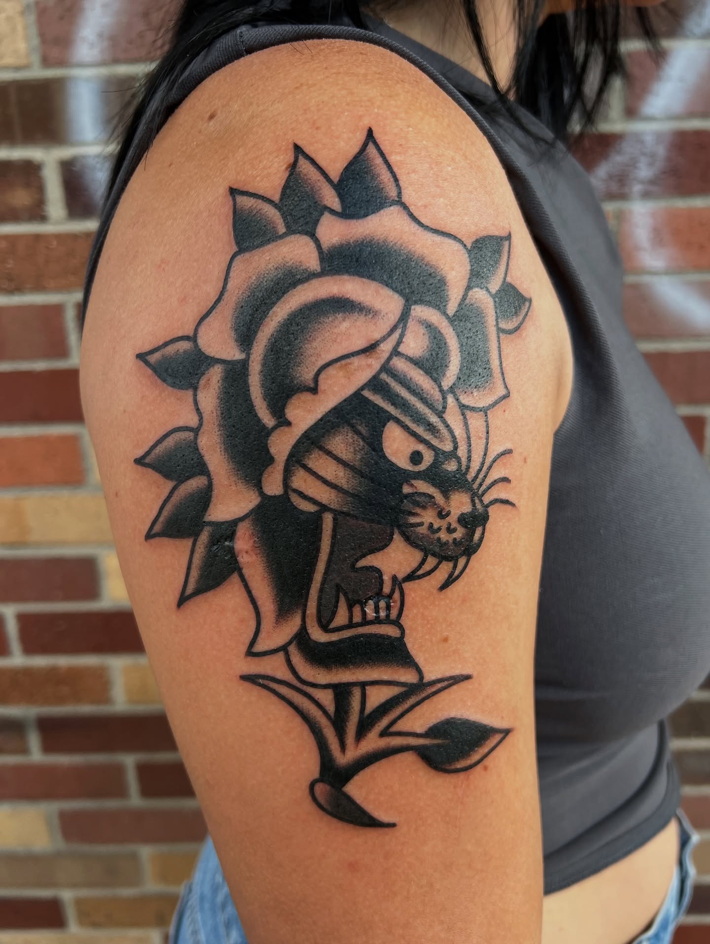 Rose with cat black and grey tattoo on the shoulder by Nick Judkins Tattoo