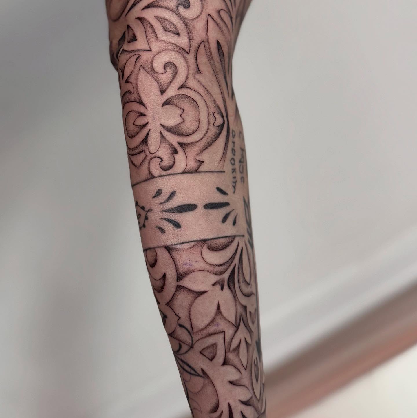 Floral pattern ornamental tattoo on the forearm by Claire Litsey
