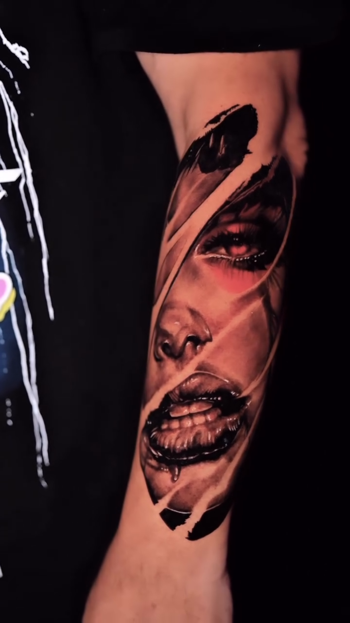 Torn skin revealing a face realism tattoo by Kiefer Fonseca