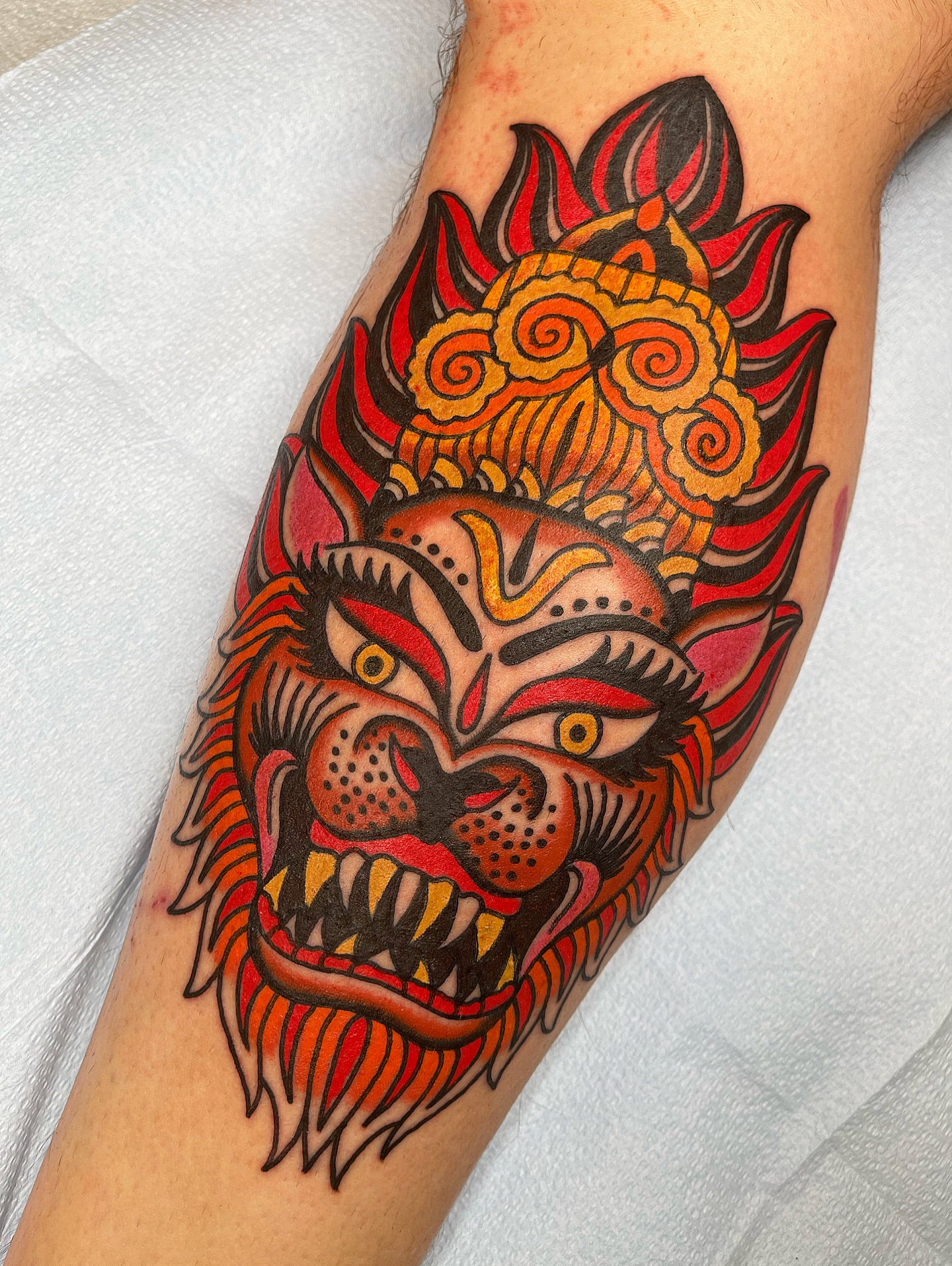 Demon mask American traditional tattoo on the forearm by Swasthik Iyengar, New York, New York