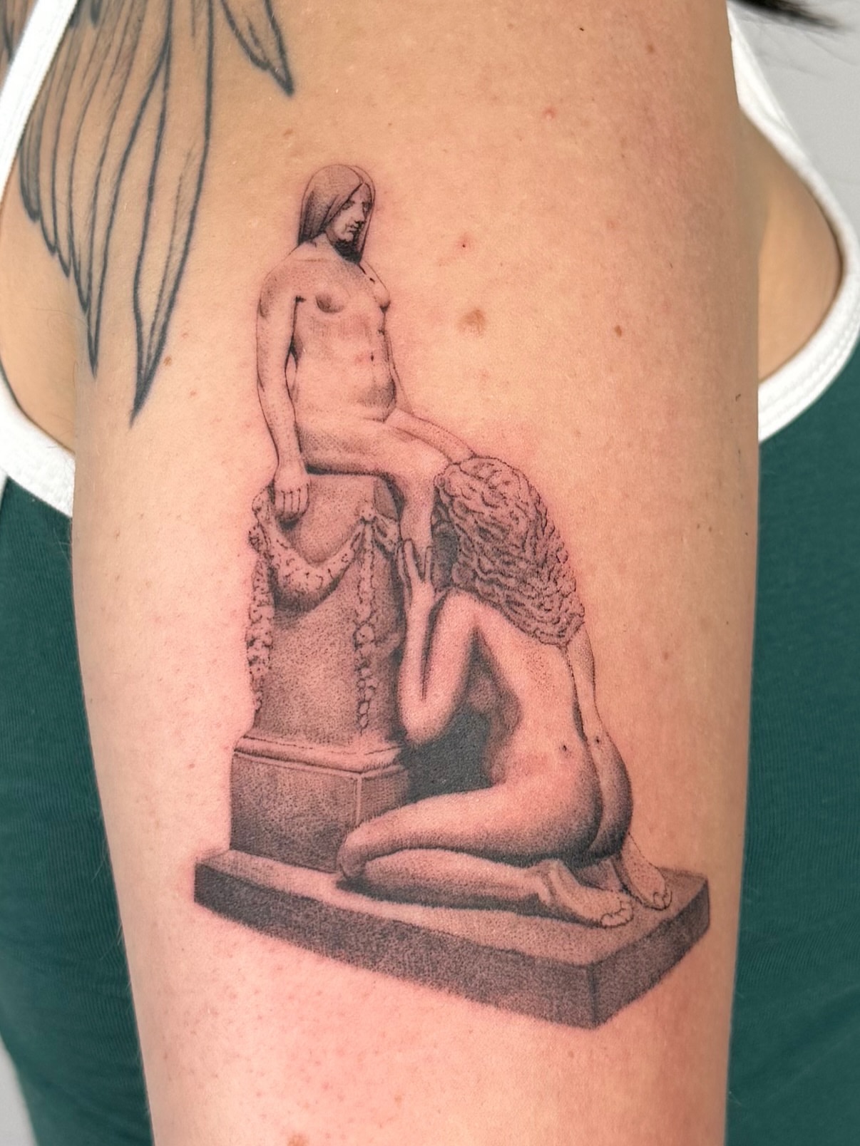 Statue scene realism tattoo on the forearm by bre
