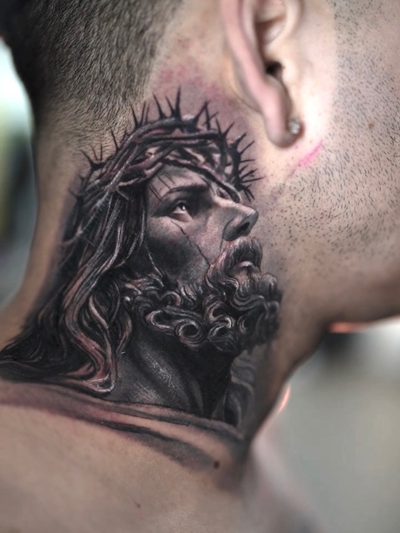 Jesus Christ realism tattoo on the neck by Nestor Palacios