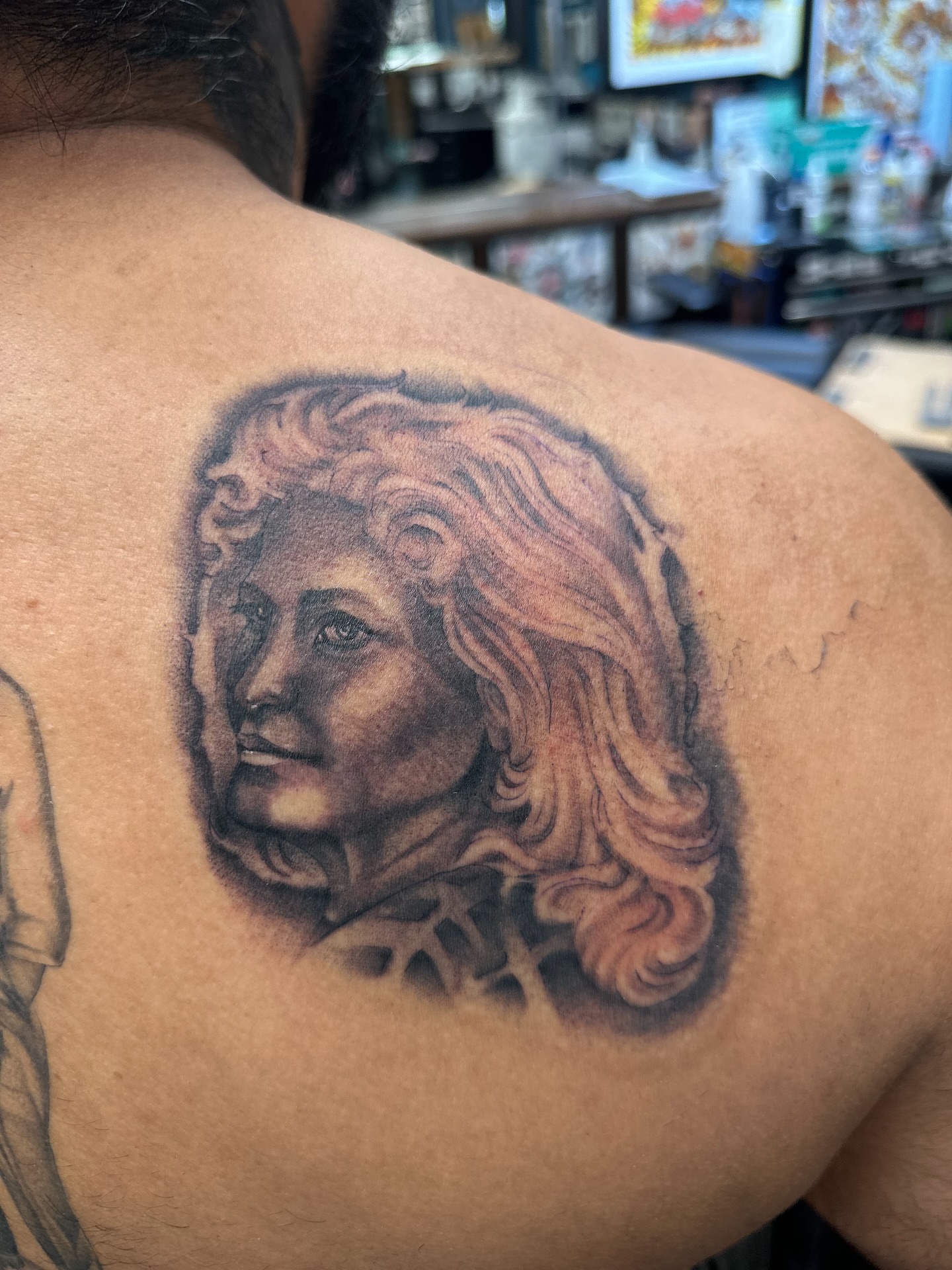 Portrait realism tattoo on the shoulder by Stevie O'Dell