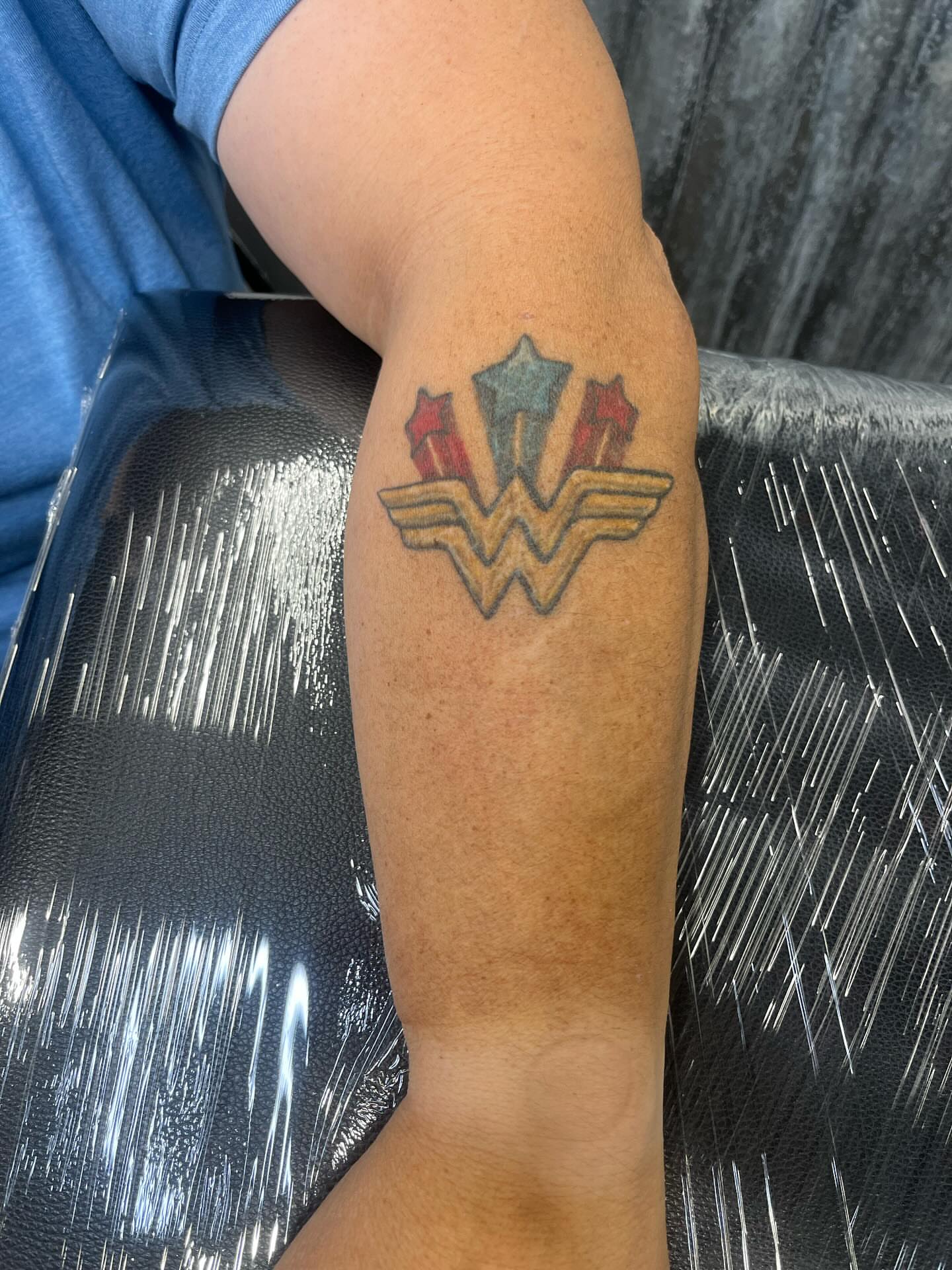 Wonder Woman logo new school tattoo on the forearm by Ink by Hailey π
