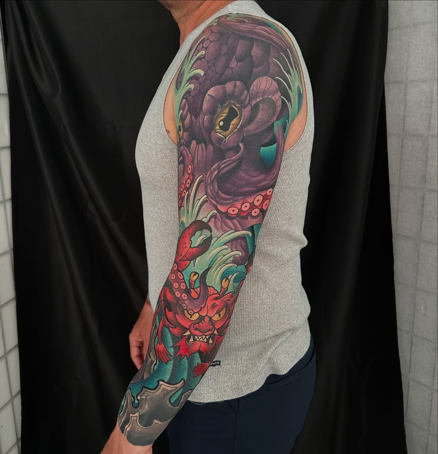 Octopus and dragon japanese irezumi tattoo on the upper arm by Pat Patterson Florida Tattoo Artist