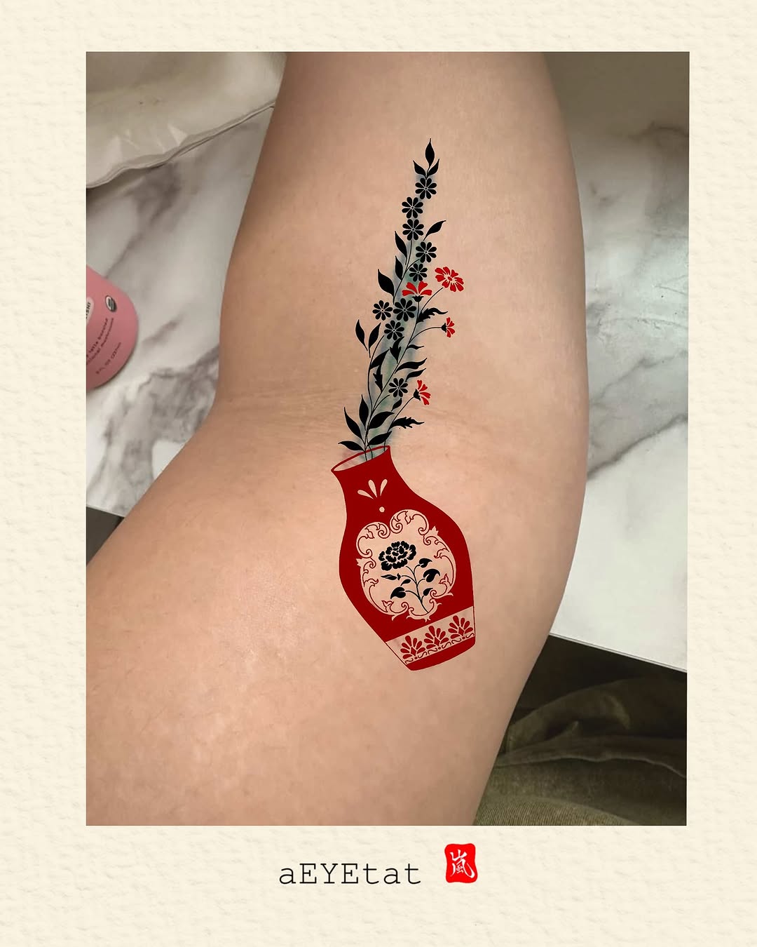 Vase with flowers surrealism tattoo on the thigh by A. Eye Tat