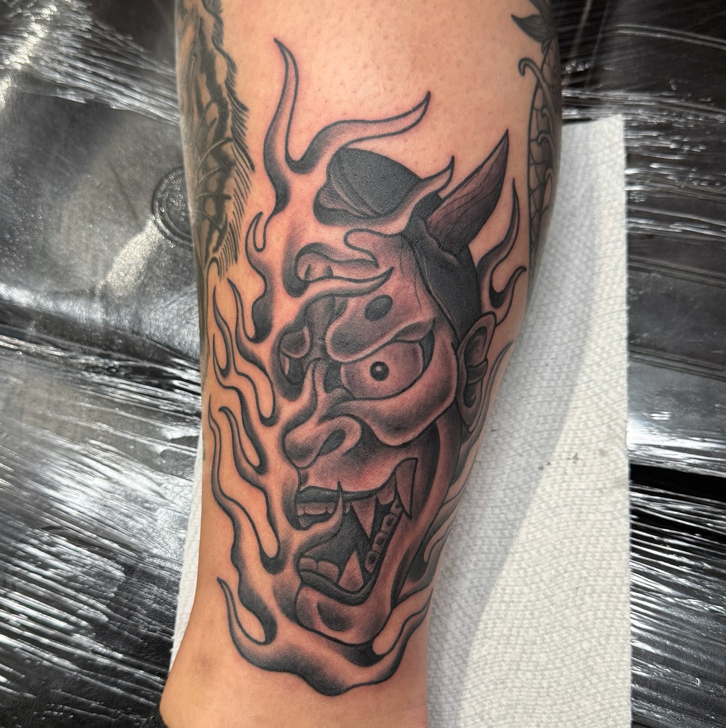 Demon mask japanese irezumi tattoo on the forearm by kenneth nash