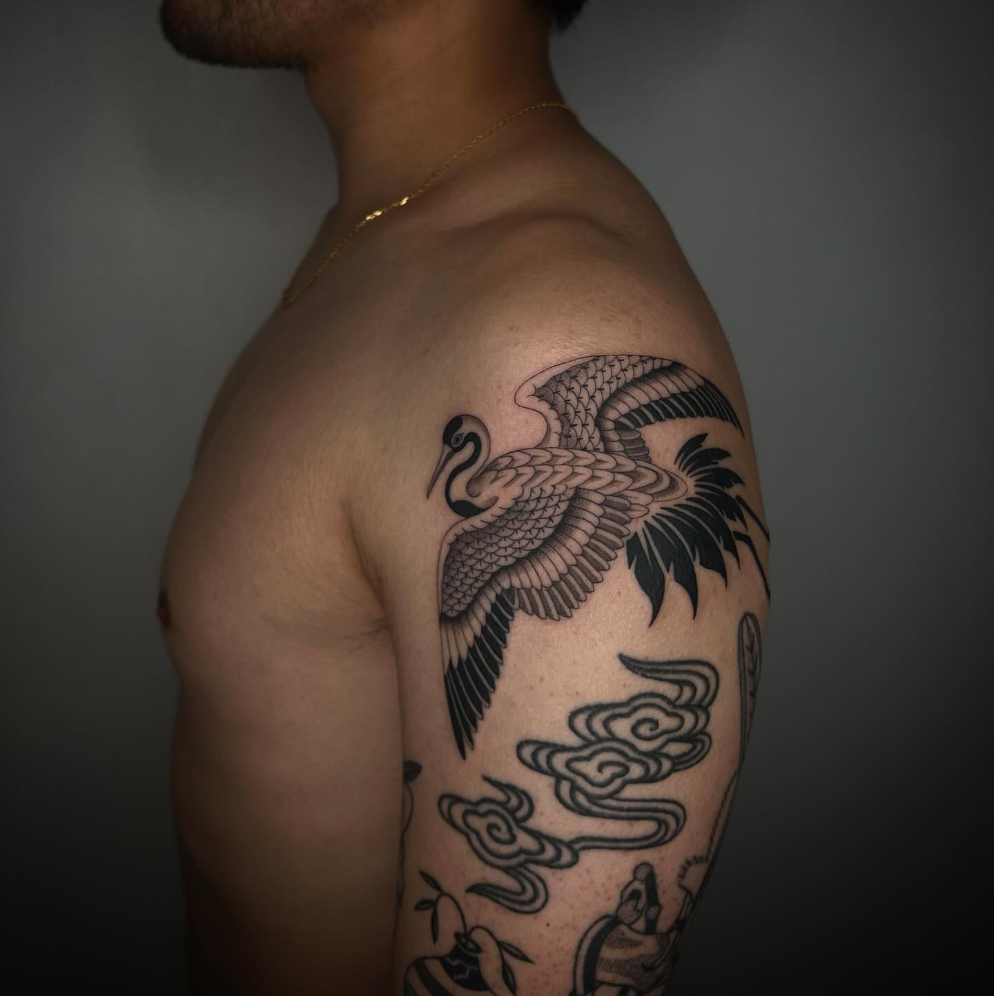 Bird and clouds black and grey tattoo on the shoulder by linahsiaotattoo