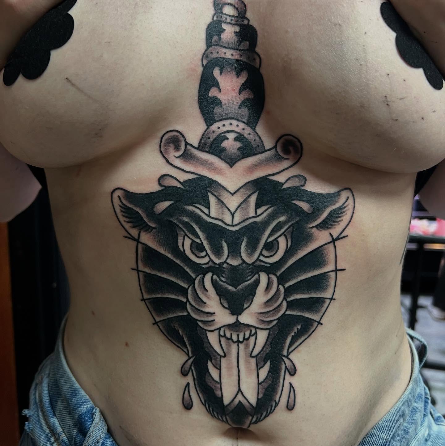 Panther head black and grey tattoo on the ribs by doodle