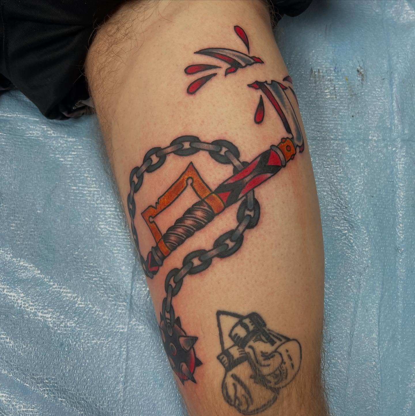 Chains and dagger American traditional tattoo on the forearm by doodle