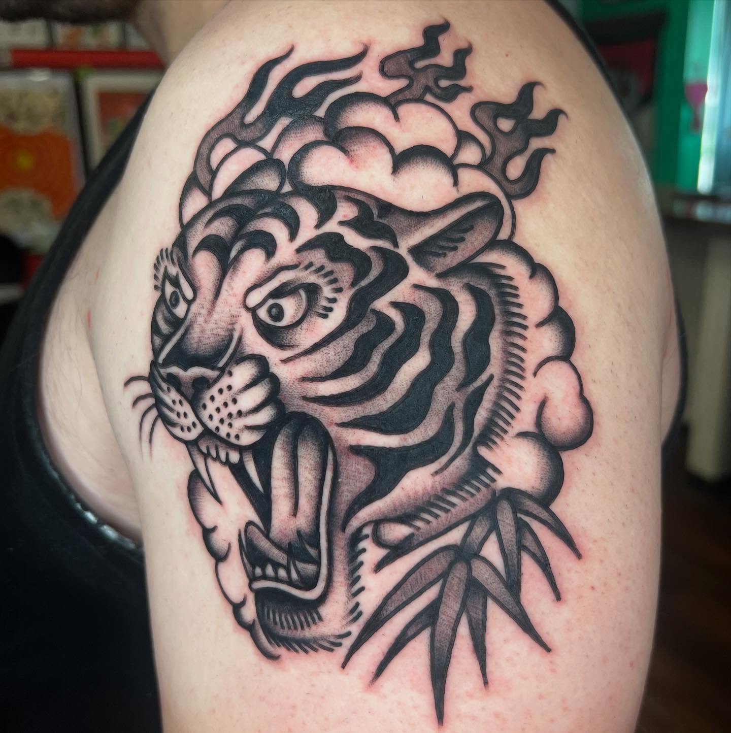 Tiger American traditional tattoo on the shoulder by Kevin Caruso