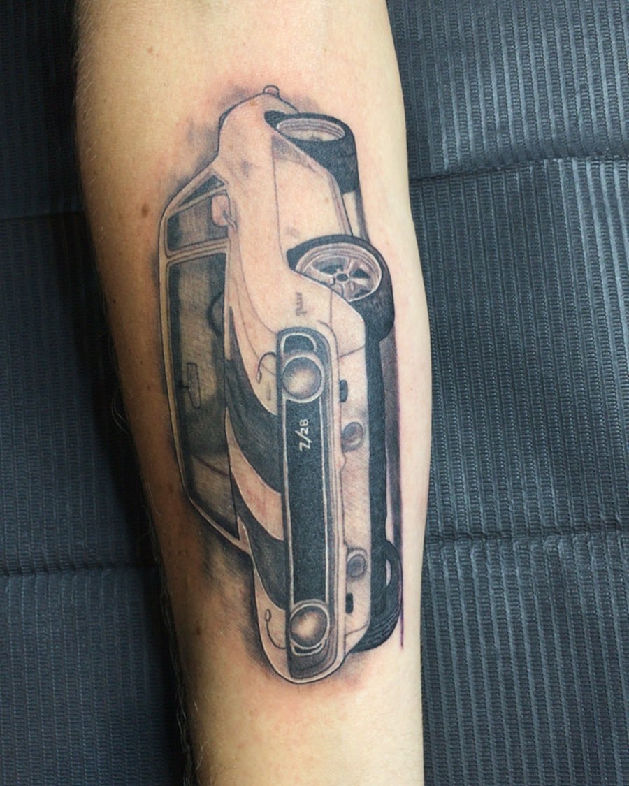 Classic car tattoo on the forearm by Joshua Shawn