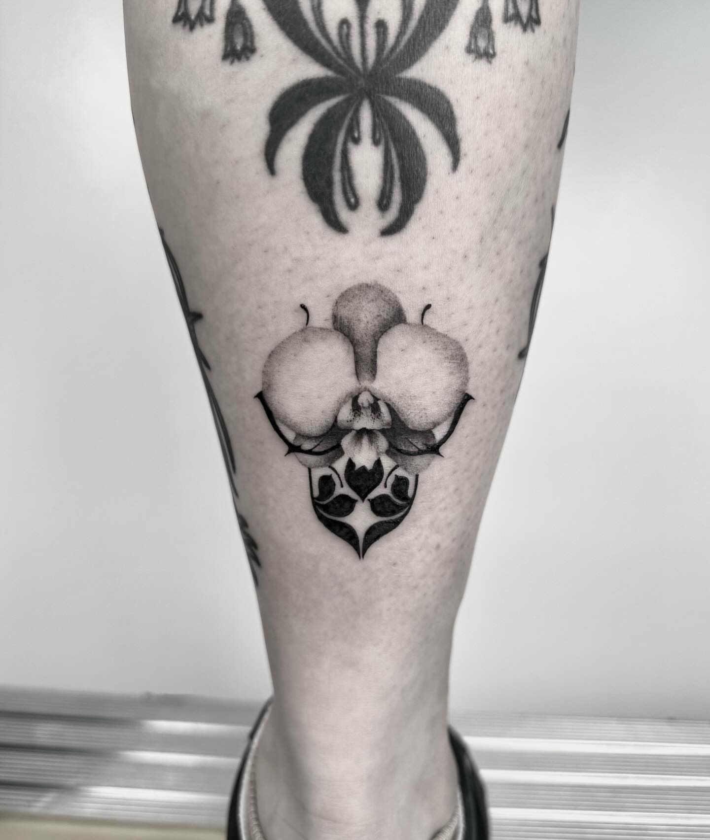 Orchid geometric tattoo on the calf by ππππππ