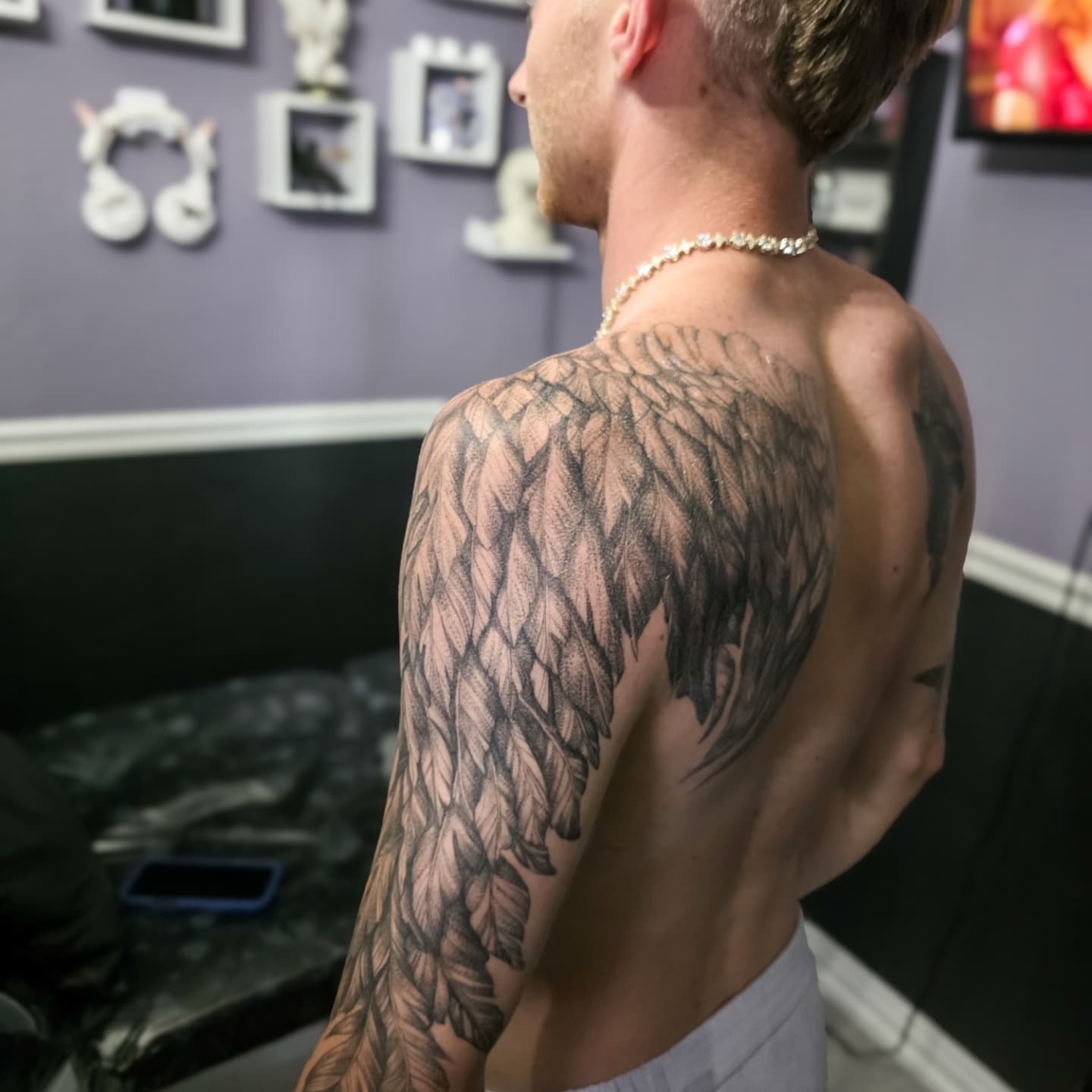 Wing black and grey tattoo on the back by Utah Tattoo Artist