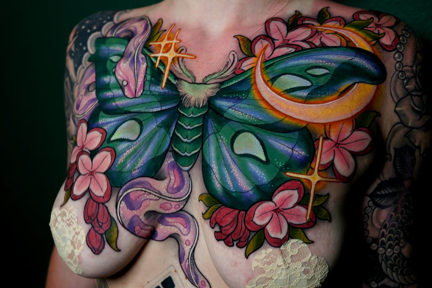 Butterfly and flowers American traditional tattoo on the chest by π·πΉππππ π²πππππ·